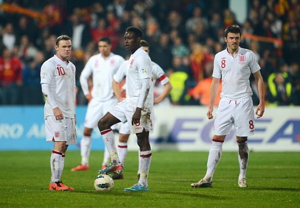 PODGORICA, MONTENEGRO - MARCH 26: (L-R)Wayne Rooney, Danny Welbeck and Michael Carrick of England look dejected during the FIFA 2014 World Cup Qualifier Group H match between Montenegro and England at City Stadium